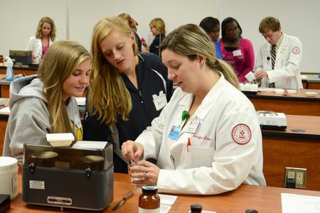 Pharmacy student Jennifer Felder explains a demonstration to prospective students visiting the School of Pharmacy.