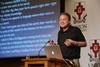 Jeffrey Hardin, professor and chair of the department of zoology at University of Wisconsin-Madison, speaks on "Glory in Fascination" to members of the Pew Research program. - Photo by Jacob Moore