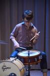 Aaron Beasley, graduate assistant to the Office of Spiritual Life, plays drums before Poly Rouse speaks in chapel. - Photo by Zac Calvert