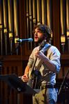 John Griffith, sophomore English major, plays the banjo and sings before Poly Rouse, senior pastor of Hermitage Hills Baptist Church, gives the message in chapel. - Photo by Zac Calvert