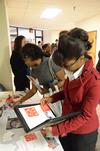 Melanie Taylor, junior sports management major, and Reneé Jones, associate director of the Vocatio center for life calling and career, look at fliers and information at Career U. - Photo by Zac Calvert