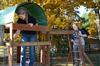 Sarah Bostic, freshman nursing major, and Bri Hansen, senior social work major, prepare to paint a playground at Pleasant Plains Baptist Church in Jackson during Campus and Community Day. - Photo by Jacob Moore