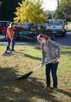 Julie Hembree (front), sophomore art major, and Maddie Russo, senior learning foundations major, rake leaves at Pleasant Plains Baptist Church during the ninth annual Campus and Community Day. - Photo by Jacob Moore