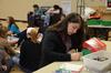 11/1/11 - During Campus and Community Day, Emily Williams, freshman elementary education major, writes a note to put inside an Operation Christmas Child box going to a child in need.  - Anne Richoux