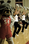 02/21/04 - Buster the Bulldog joins forces with the cheerleaders and the home crowd during basketball games. He can be found roaming around the gym, rousing the crowd and playing with children.
