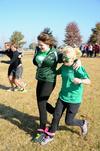 Morgan Jones, freshman nursing major, competes in a three-legged race with Ruthie Hall, freshman English major, during Homecoming Olympics. - Photo by Jacob Moore