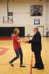 David S. Dockery, president of the university, presents the Community Service Award to Brittany Bural, junior social work major, during the homecoming weekend festivities.  - Photo by Zac Calvert