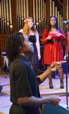 Derique Cannon, junior electrical engineering major, leads MOSAIC choir as they perform in chapel. - Photo by Zac Calvert