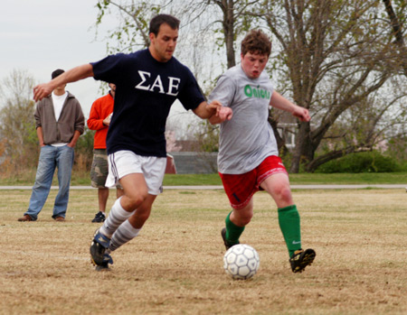 Jonathan Harris and Brandon Nelms battle for position during the men's intramural soccer championship between SAE 1 and Onions 1.