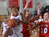 11/19/11 - Despite heavy pressure from Saint Xavier Union's Lavanda Ross was able to score points at will.