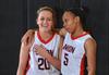 11/323/11 - Amy Philamlee and LeTesa McLaughlin share a fun moment in the waning moments of their game with Saint Xavier University.