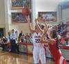 Under the watchful eye of Coach Campbell Union's Amy Philamlee gets the shot off under pressure from Saint Xavier. - Photo by Morris Abernathy