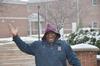 Housekeeping Supervisor Gene Hunt says good morning while the snow falls.  - Photo by Morris Abernathy
