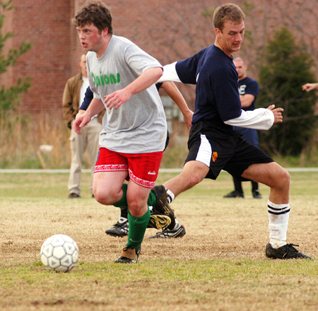 Action from the men's intramural soccer championship between SAE 1 and Onions 1.