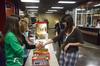 Maggie Ledbetter, senior physical education and health major, picks up some candy during Sac's Movie in the Bowld.  - Photo by Zac Calvert