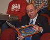Students gathered in the McAfee commons to hear David S. Dockery  read the Christmas story. This is one of the tradition's during the last weeks of the semester here at Union. David Dockery reads The Night Before Christmas. - Photo by Morris Abernathy