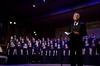 Chris Mathews, associate professor of music and department chair, leads the audience and the music department in a Christmas carol during "A Union Christmas." - Photo by Ebbie Davis