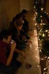 Students enjoy some snacks in McAfee Commons as they wait for the Dockerys to read the Christmas story.   - Photo by Ebbie Davis