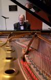 Terry McRoberts, university professor of music, warms up before his piano recital in Hartley Hall. - Photo by Jacob Moore