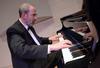 Terry McRoberts, university professor of music, performs a faculty recital in Hartley Hall. - Photo by Jacob Moore