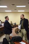 Hunter Baker, associate professor of political science, and Micah Watson, assistant professor of political science, chat in between Town & Gown sessions. - Photo by Zac Calvert