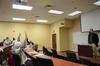 Micah Watson, assistant professor of political science, asks for crowd participation during a discussion on the drastic changes of American politics and the splinter effect of news and media during a Town & Gown session in Providence Hall. - Photo by Zac Calvert