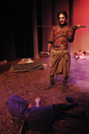 Ryan Schunnemann wields his sword as Macbeth in <i>Macbeth</i>. - Photo by Jim Veneman