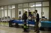 Allison Martin, sophomore pre-physical therapy major, talks with Kirby Lewis, junior political science major, about external study programs at an external study fair in the Penick Academic Complex.  - Photo by Anne Richoux