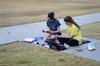 Sophomores Laura Axelson, elementary and special education major, and Jessica Frizzell, nursing major, enjoy a warm, sunny day outside in Ayers Quad. - Photo by Anne Richoux