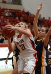 Amy Philamlee goes up for a shot against Lady Topper Chelsea Hussey of Blue Mountain College. - Photo by Jacob Moore