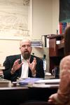 2/24/12 - Micah Watson, assistant professor of political science, talks with a student in his office. - Kristi McMurry