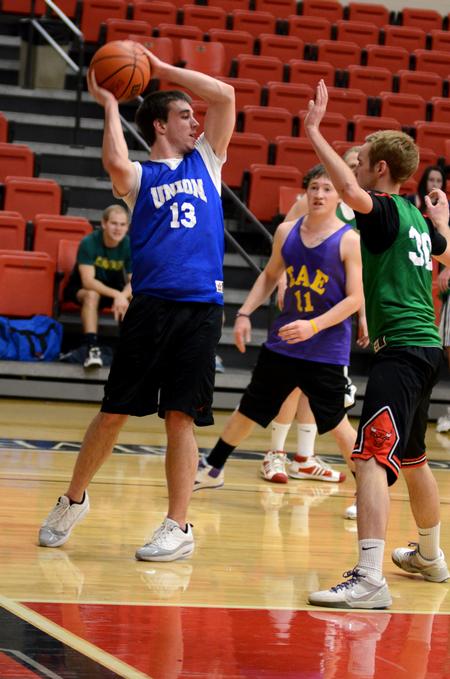 Jared Haney, sophomore business administration major, looks for a teammate to pass the ball to during an intramural game.