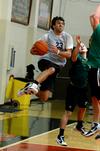 Chase Tuggle, senior youth ministry major, goes up for a shot against Lamda Chi players during an intramural basketball game. - Photo by Anne Richoux