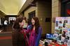 Victoria Malone, instructor of language, laughs with Kendra Loh, sophomore psychology major, during CultureFEST. - Photo by Zac Calvert