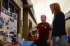 Dionna Linn, sophomore athletic training major, talks about the culture and geography of Venezuela with Julie Glosson, professor of language, during CultureFEST. - Photo by Zac Calvert