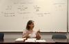Irene Schock, adjunct ASL instructor, demonstrates how to use classifiers in her American Sign Language class. - Photo by Ebbie Davis