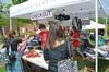 The big red bus stopped at Union University April 3 and offered Union students an opportunity to donate clothes, buy clothes that had been previously donated and interact with Chapman and other representatives from the Red Bus Project.   Students check out after picking out some clothing from the bus. - Photo by Morris Abernathy