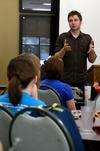 Travis Cottrell talks to students about his duties as worship pastor at Englewood Baptist Church during a CCMS event.  - Photo by Anne Richoux