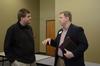 Will Miller (left), junior biblical languages major, talks with Joshua Moore, assistant director for church relations, following a CCMS event.  - Photo by Anne Richoux