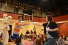 Luka Perkovic, sophomore business administration major, is presented a giftcard from Ashley Jackson, resident director, during Eggstravaganza. - Photo by Zac Calvert