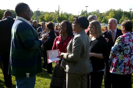 4/12/12 - Nigel Manuel, senior media communications major, Reneé Jones, associate director of the vocatio center for life calling and career, Jacqueline Taylor, assistant dean of students, and Bethany Morse, director of the Hundley Center, chat together after the groundbreaking for the new library.