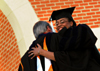 5/22/04 - Director of Career Services Jacqueline Taylor is hugged by President Dockery shortly after receiving her Master of Arts in Education degree at spring commencement. - Jonathan Blair