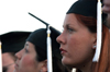 English graduates Erin Hetzel and Heather Hodges at spring commencement. - Photo by Jonathan Blair