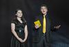 SAC members AlLee Browning, junior elementary education major, and Matt Parker, senior business administration major, announce category winners during the 15th annual Variety Show. - Photo by Morris Abernathy