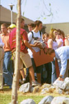 Digital Media Studies major Jonathan Miller carries his load during the removal of the stones at the September 11 Service of Remembrance and Response. - Photo by Jim Veneman