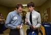 Brady Sheppard and Jon Vunk, junior engineering majors, look through information on the companies represented at an engineering and technology expo, which was hosted by the Vocatio Center for Life Calling and Career. - Photo by Jacob Moore