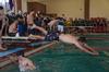 Cody Styx, sophomore business administration major and member of Alpha Tau Omega, dives into the pool during Greek Olympics. - Photo by Zac Calvert