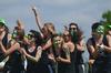 Kappa Delta members Allison Gooch, senior biology major, Caisie Jordan, sophomore special education major, and Mary Jane Garrott, junior art major, celebrate after winning the football toss during Greek Olympics. - Photo by Zac Calvert