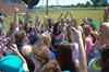 Heather Dragg, senior psychology major, leads Zeta Tau Alpha in a cheer during Greek Olympics. - Photo by Zac Calvert