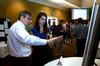 5/1/12 - David Ward, professor of physics, talks with Caroline McConnell, junior engineering major, about her research poster during the Scholarship Symposium. - Anne Richoux